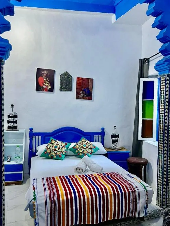 Colorful bedroom at Maison Bleu Hajja in Tangier