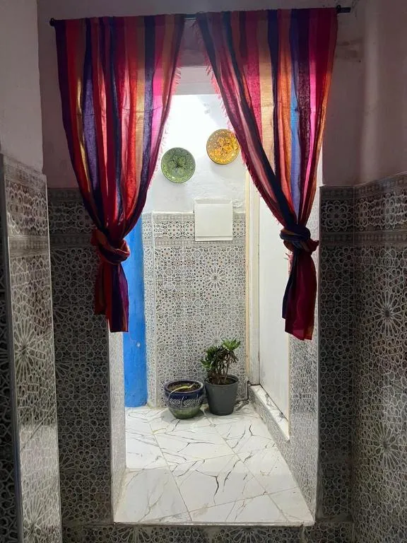 Decorative corridor at Maison Bleu Hajja in Tangier