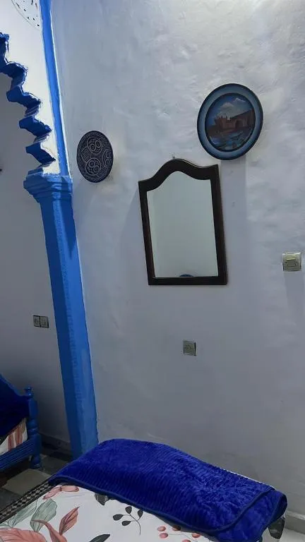 Wall decor in a bedroom at Maison Bleu Hajja in Tangier