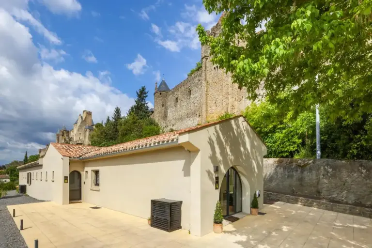 Exterior view of Maison Thérèse with castle