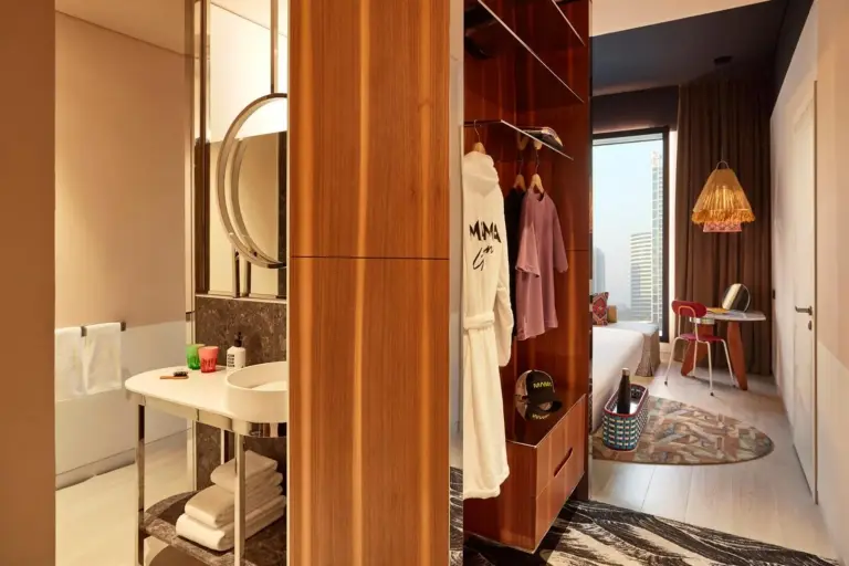 Bathroom and bedroom area in Mama Shelter Dubai guest room with modern design