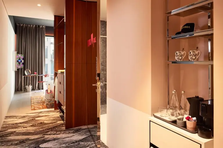 Hallway with in-room coffee station and bedroom entrance at Mama Shelter Dubai
