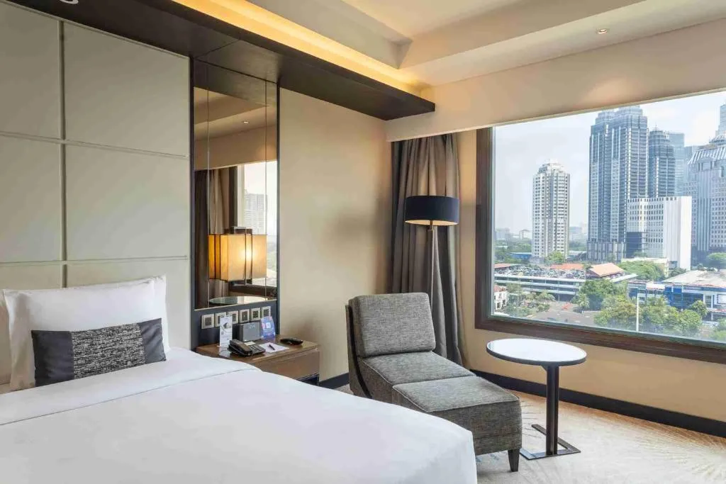 Cozy guest room at Mangkuluhur ARTOTEL SUITES in Jakarta