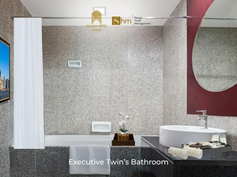 Baño de la Executive Twin Room en Manhattan Hotel Jakarta