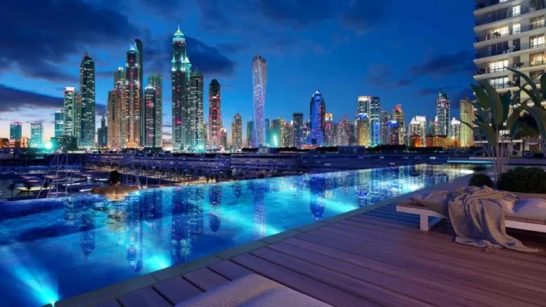 Night view of skyline from the pool area in Dubai hotel.