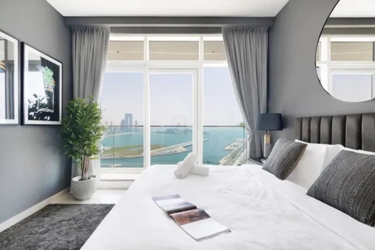 Stylish bedroom with waterfront views in Dubai hotel.