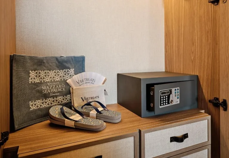 Guest amenities at Mazzarò Sea Palace including slippers and a safe