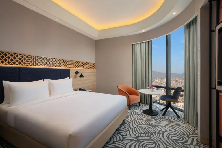 King room at Mercure Kathmandu Sukedhara Heights with large windows and mountain city views