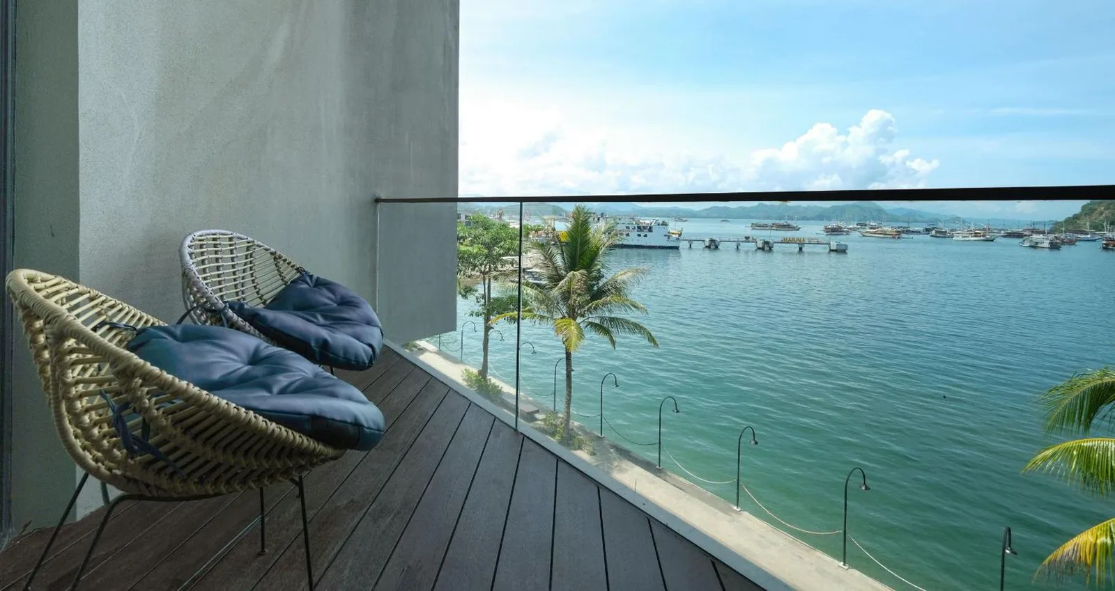 Balcony seating with ocean view at Meruorah Komodo Labuan Bajo