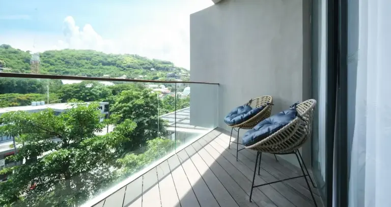 Balcony view at Meruorah Komodo Labuan Bajo overlooking the greenery