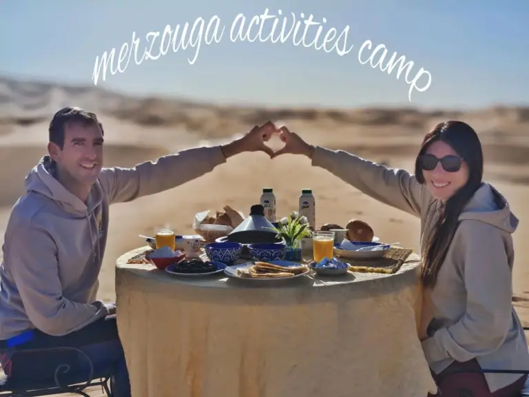 Merzouga Activities Camp outdoor breakfast setup for two in the desert of Merzouga