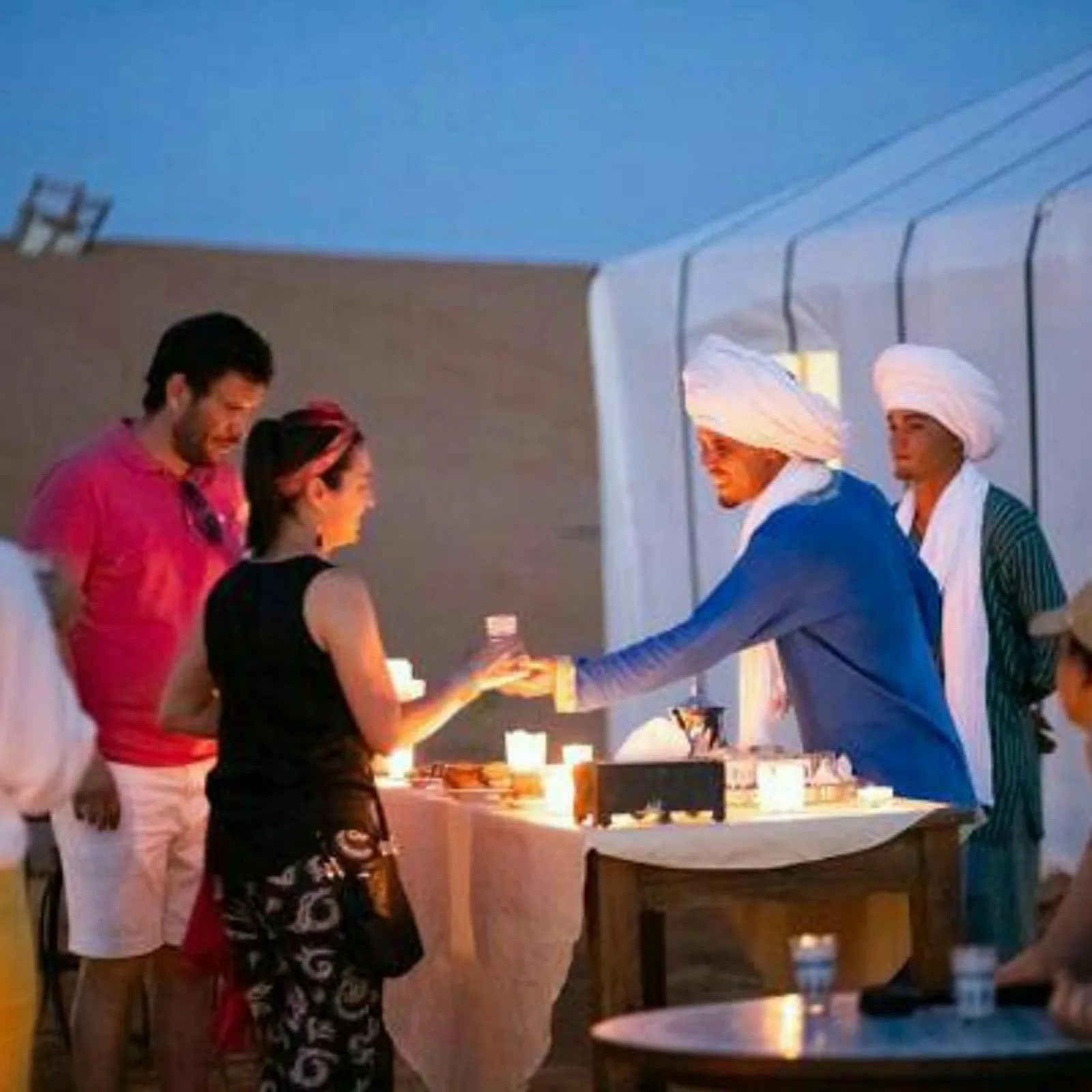 Guests enjoying service at Merzouga Best Luxury Camp