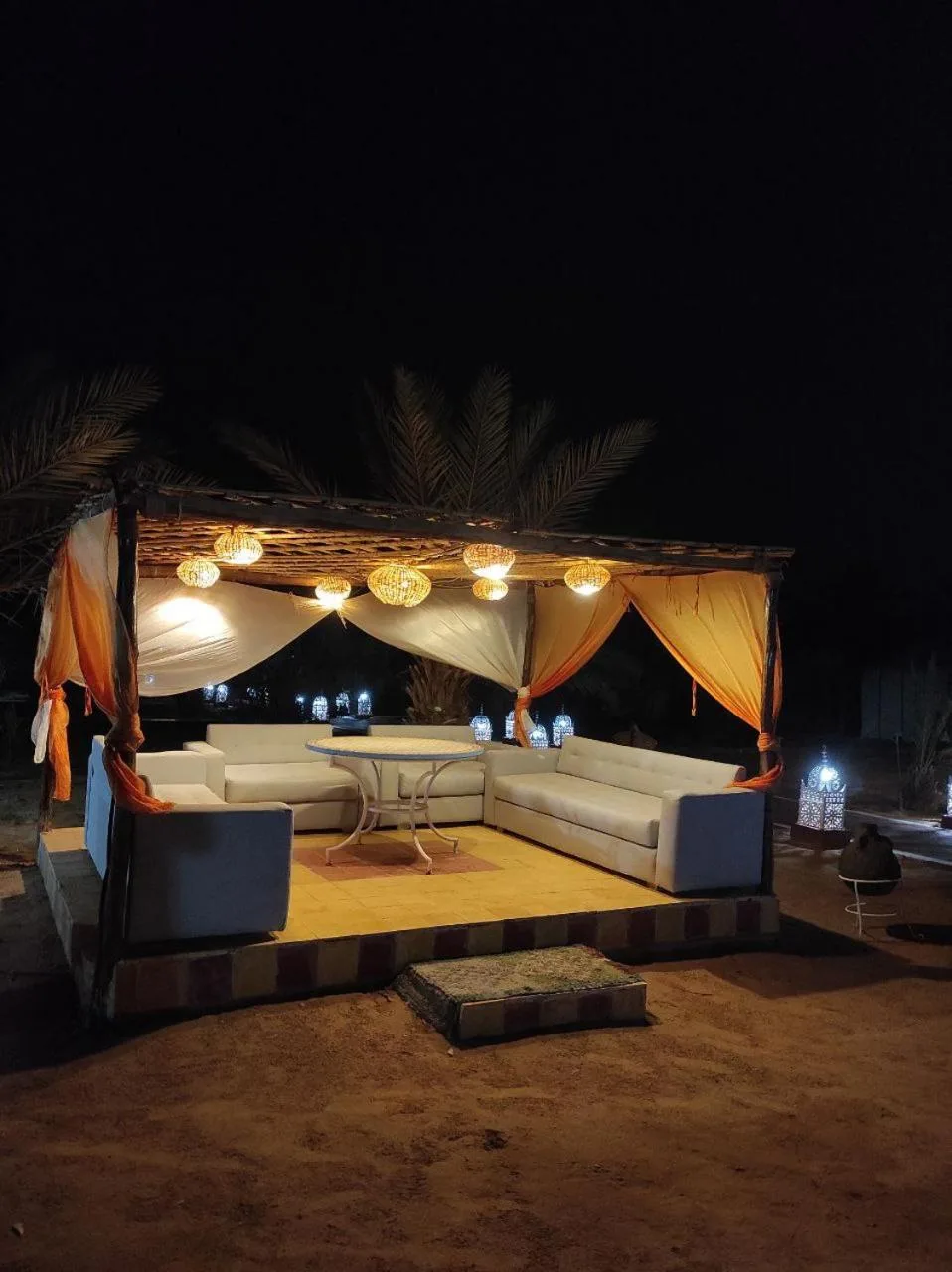 Lounge area at night in Merzouga Desert Experience Camp