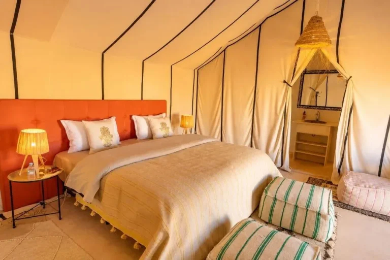 Cozy bedroom with warm tones at Merzouga Limited-Time Camp, Merzouga