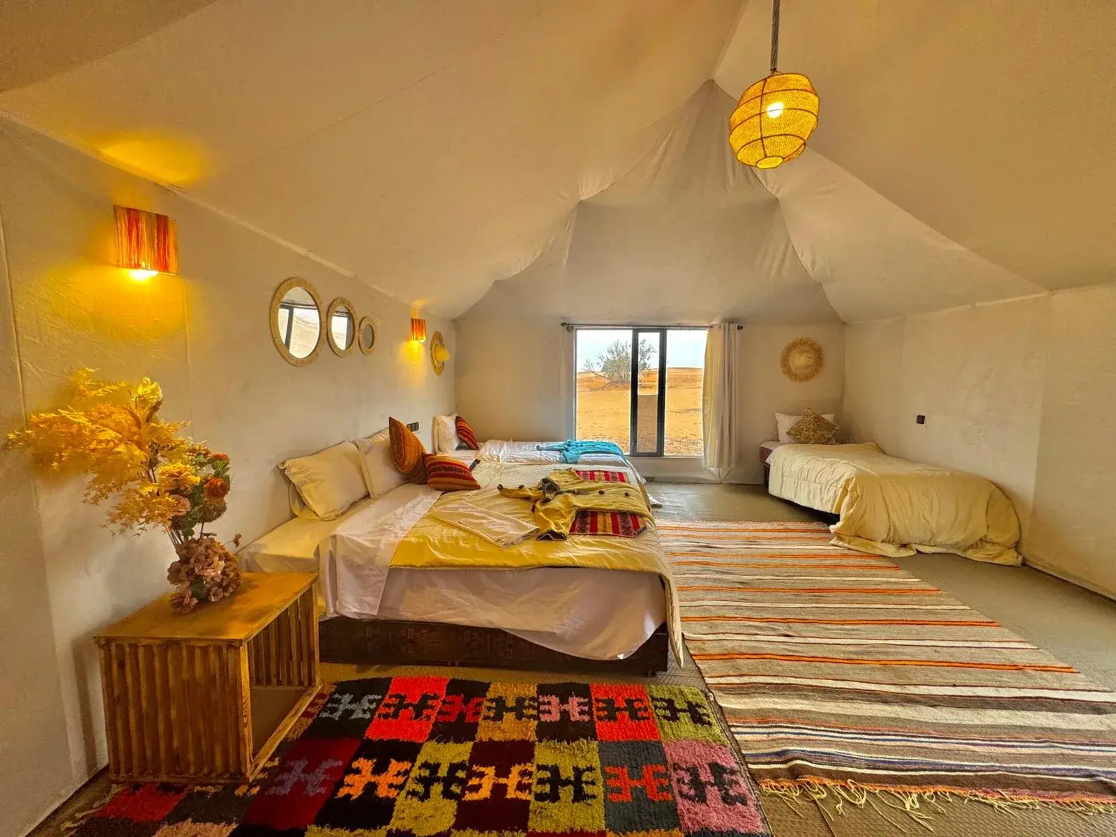Family suite at Merzouga Luxury Camp with colorful decor