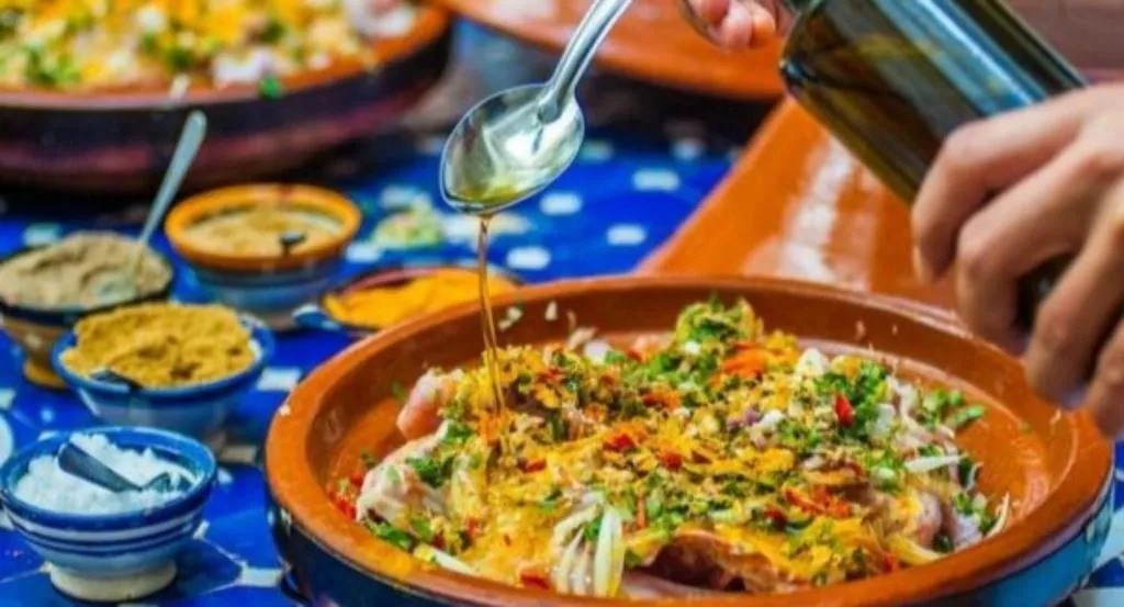 Moroccan tagine dish being prepared at Merzouga Luxury Magic Nights