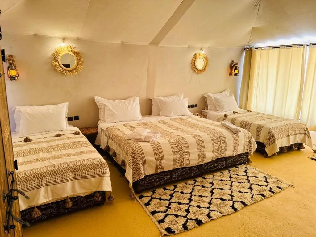 Triple room setup in Merzouga Nomads Camp
