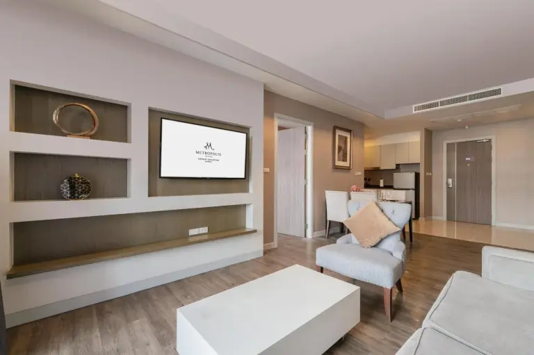 Spacious suite interior at Metropolis Suites Bangkok, Tapestry Collection by Hilton with dining area, living room, and TV