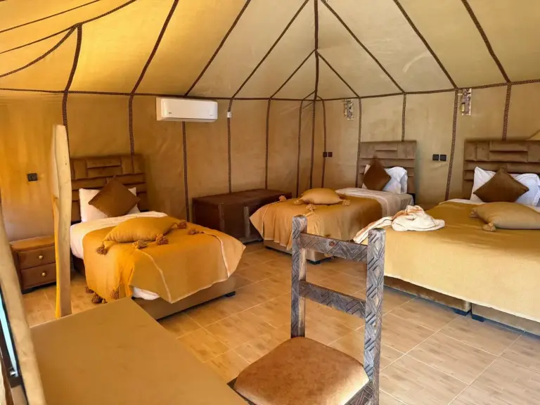 Milagro Luxury Camps in Merzouga quad tent room with four beds and air conditioning
