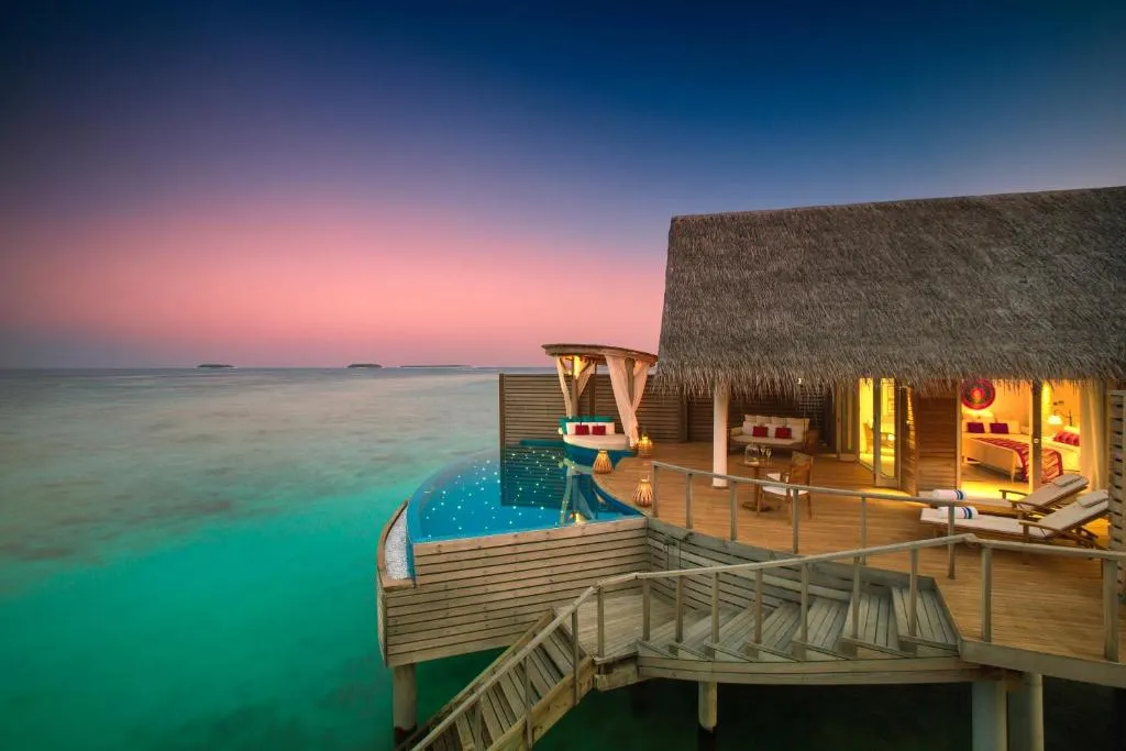 Evening view of water villa at Milaidhoo Maldives
