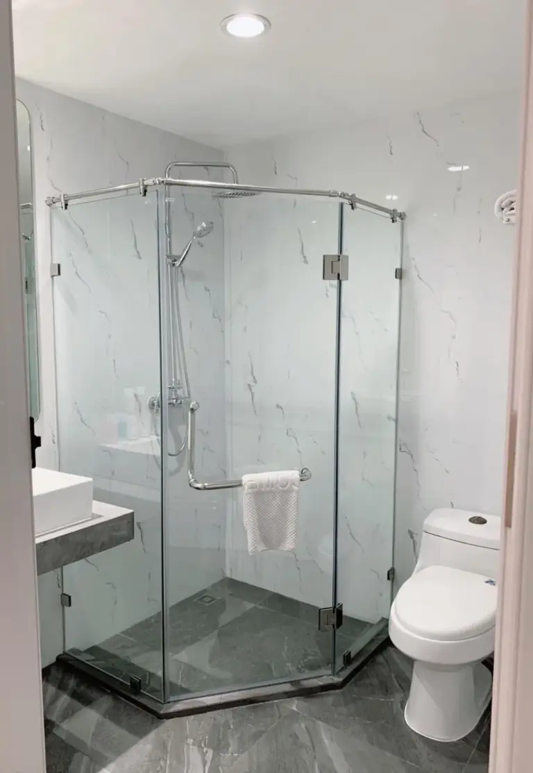 Bathroom amenities at Miloft Sathorn Hotel in Bangkok with toiletries, cups, and sink area