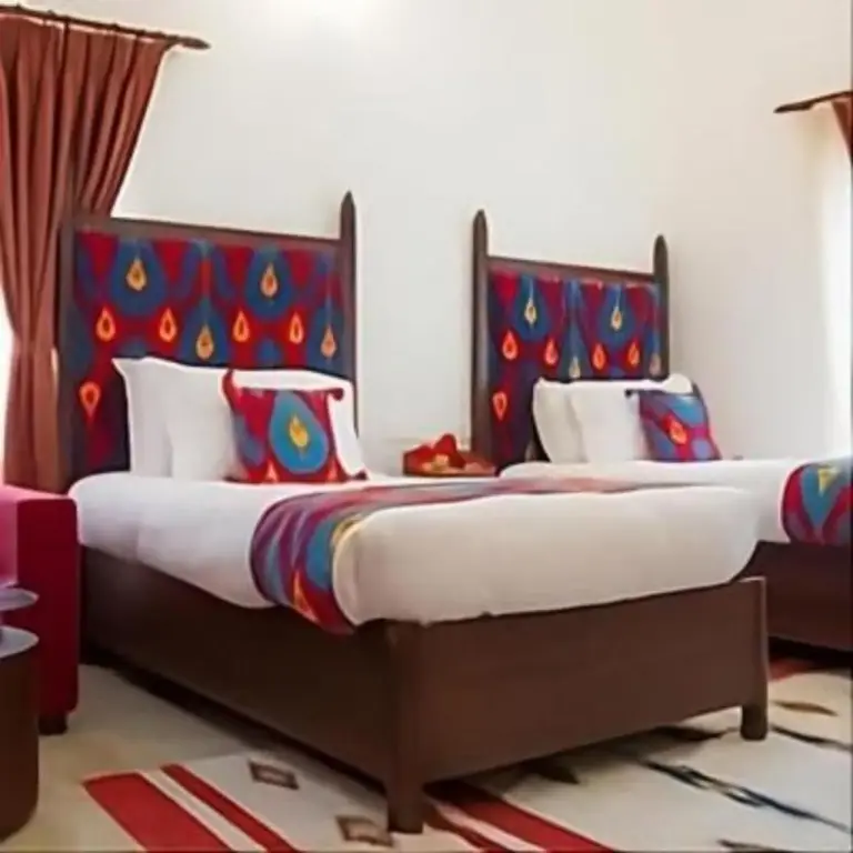 Miraaya Wellness and Golf Resort twin beds in a vibrant room