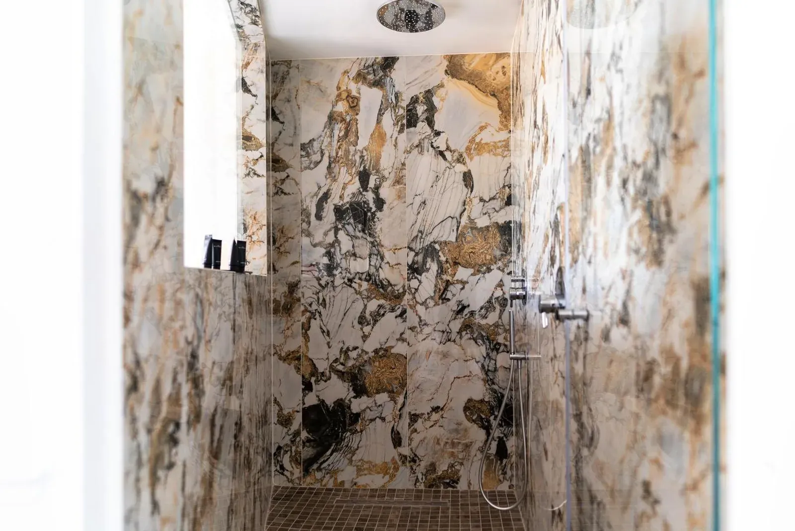 Stylish shower area at Monastero dei Santi in Rome
