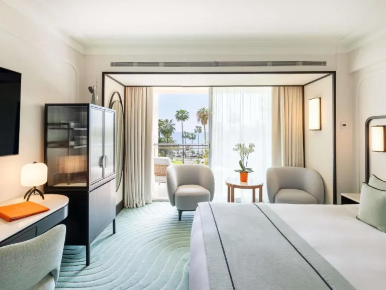 Cozy room interior at Mondrian Cannes with balcony view