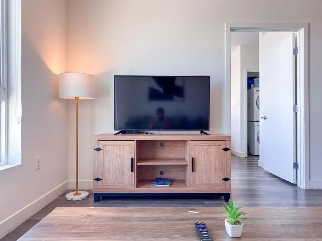 TV area in guest room at Monthier Downtown in California
