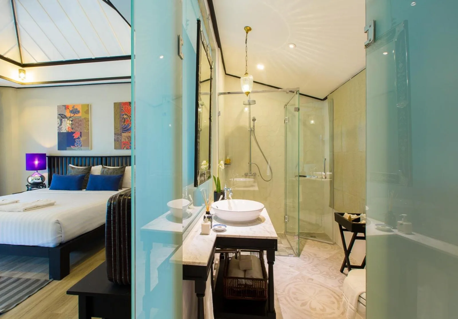 Stylish open-plan bathroom at Moracea by Khao Lak Resort in Khao Lak with shower and vanity