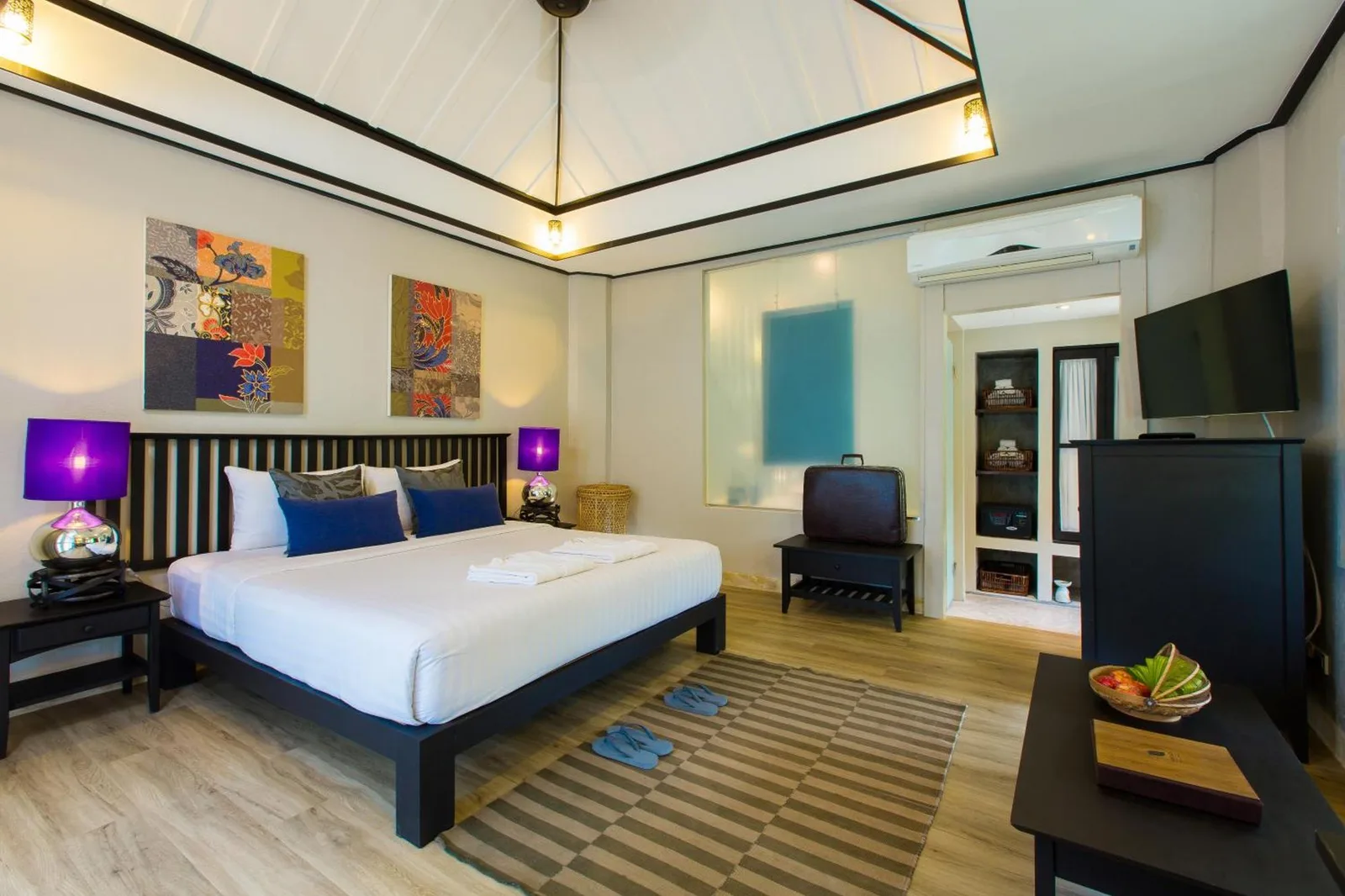 Modern bathroom at Moracea by Khao Lak Resort in Khao Lak with glass shower and vanity