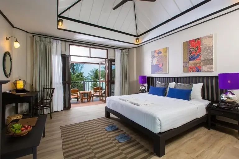 Bedroom at Moracea by Khao Lak Resort in Khao Lak with king bed and colorful wall art