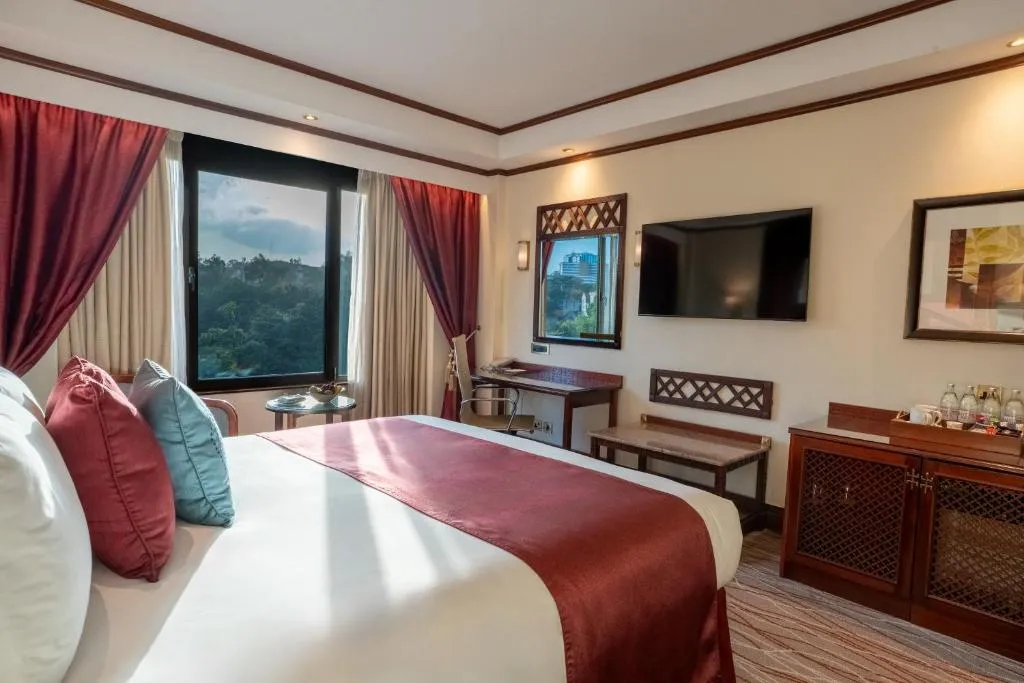 Luxurious bedroom at Nairobi Serena Hotel with elegant decor and amenities
