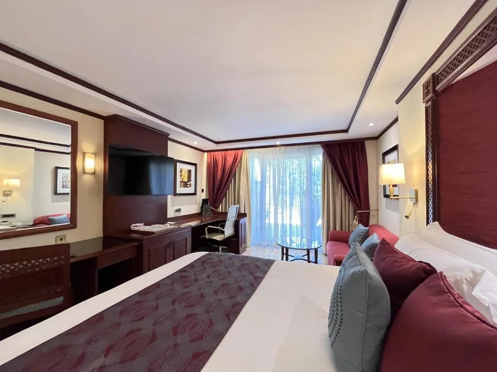 Cozy suite at Nairobi Serena Hotel showcasing a balcony view