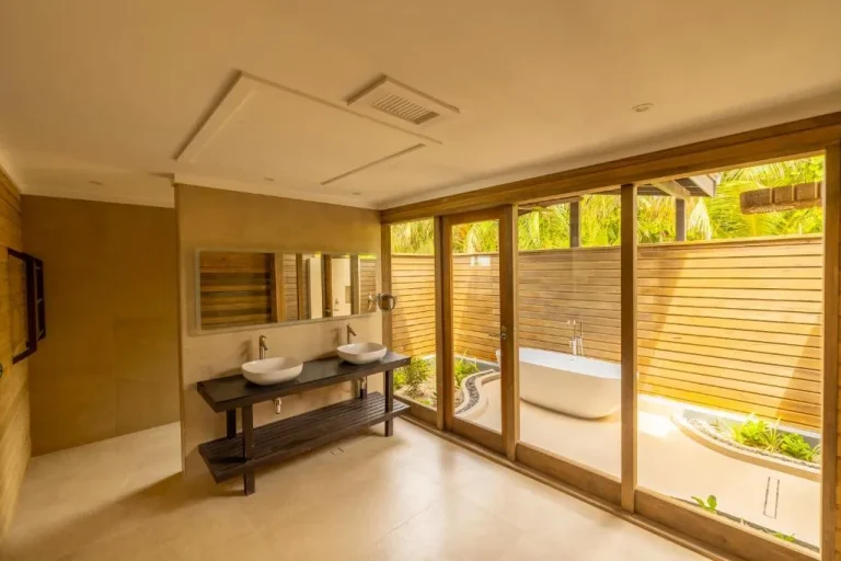 Elegant bathroom with tub at Nala Maldives.