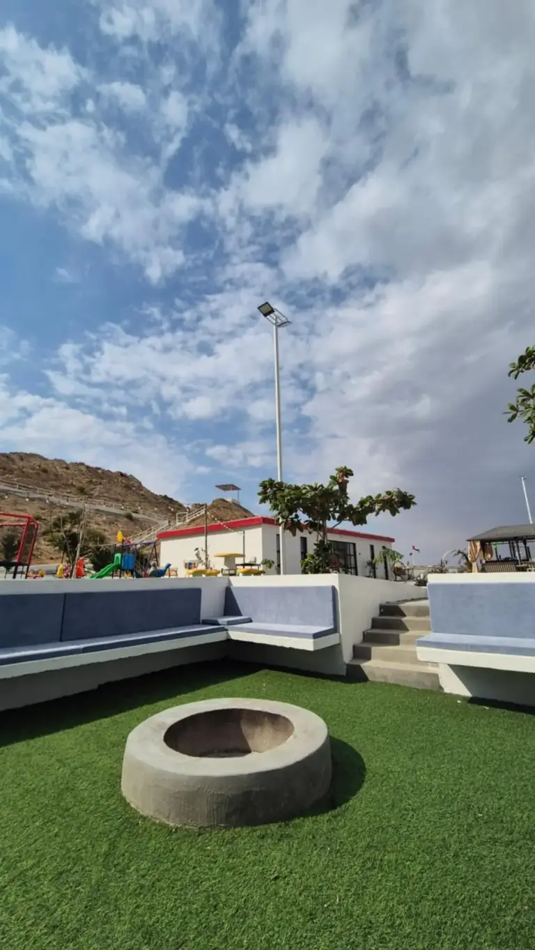 Noor-Hatta Deluxe Villa Farmhouse seating near fire pit