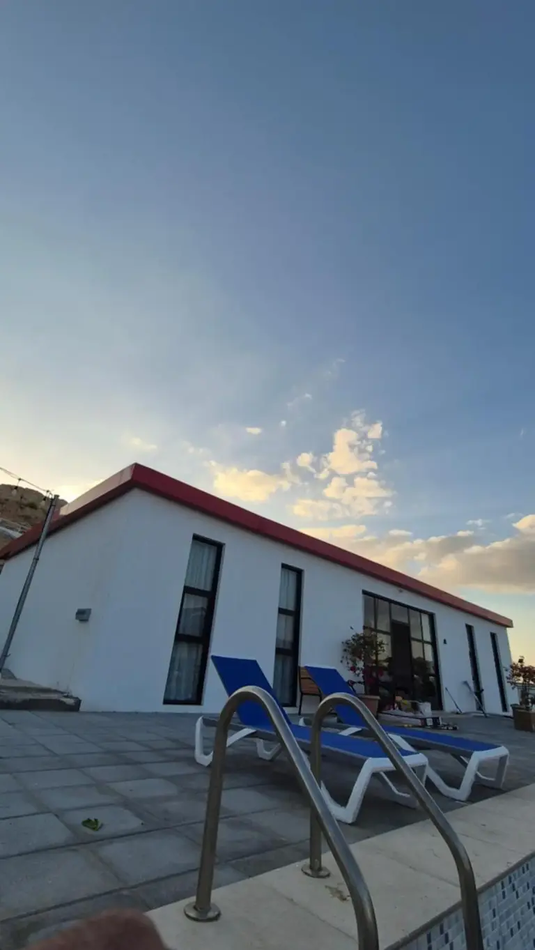 Noor-Hatta Deluxe Villa Farmhouse side view at sunset