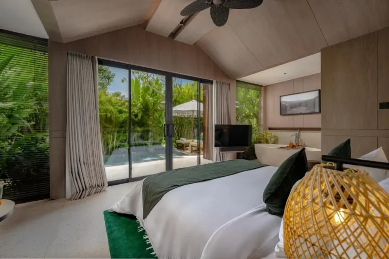Nuju Uluwatu luxury bedroom with view of the pool