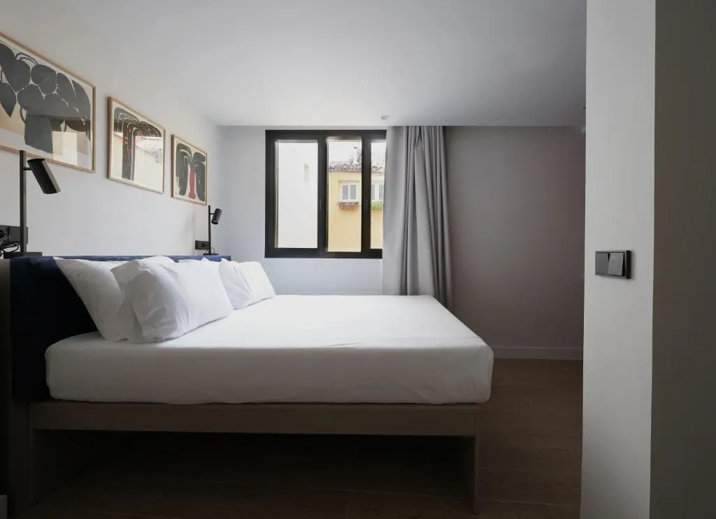Bright bedroom in Numa Madrid Sol with large windows
