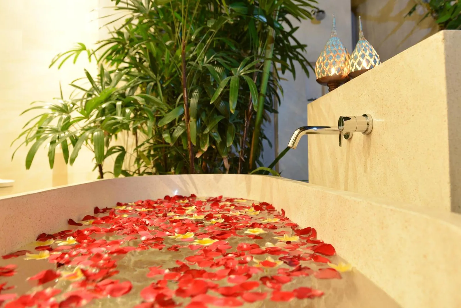 Beautiful bathtub with flower petals at Nyaman Villas Seminyak