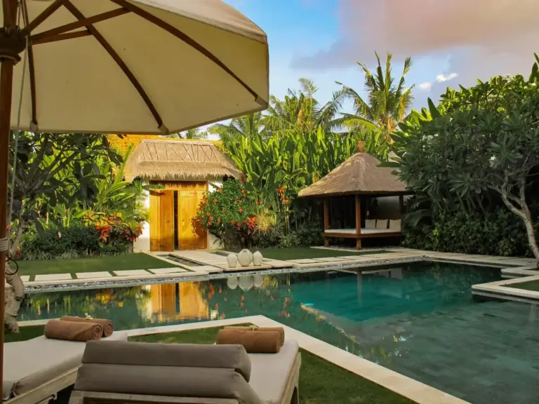 Tranquil garden view with pool at Nyaman Villas Seminyak