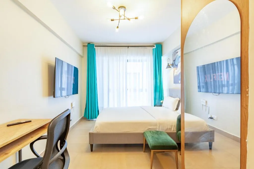Bedroom view at Nyayo Studio in Nairobi with large windows