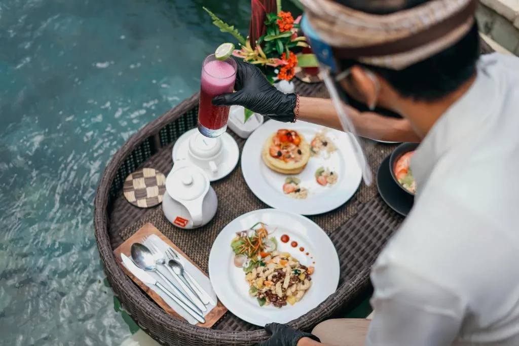 Chef preparing food at Nyuh Bali Villas in Seminyak