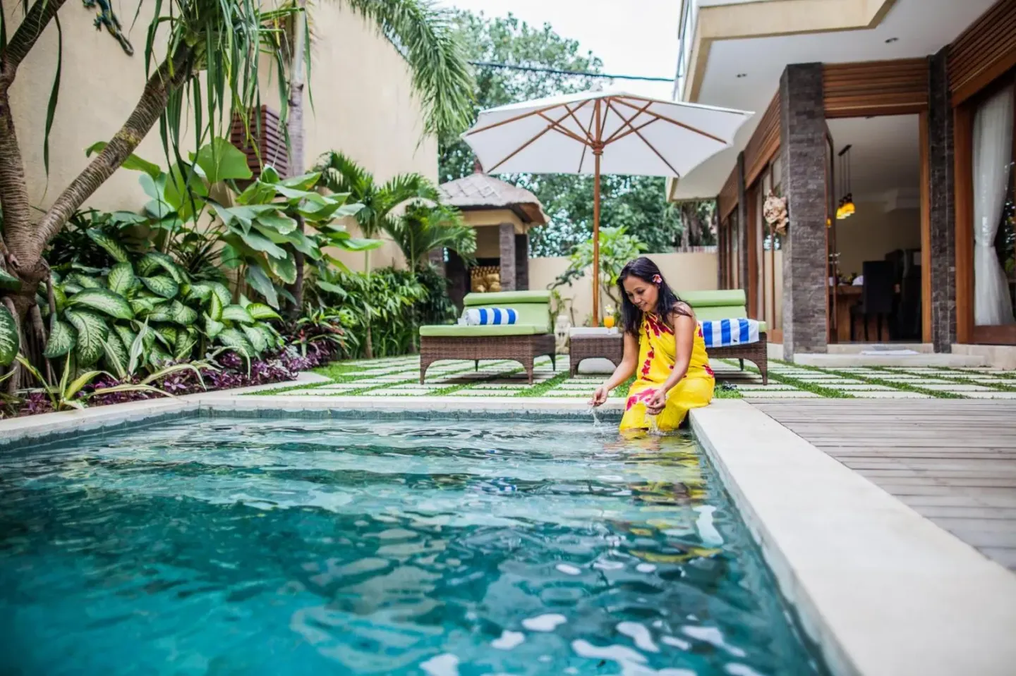 Child playing by the private pool at O Villas Seminyak