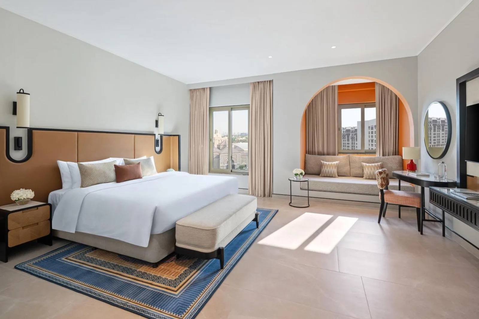 Spacious king room at Oaks Ibn Battuta Gate Dubai with modern seating and city views
