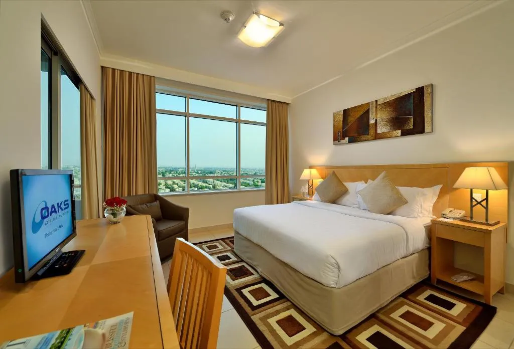 Gemütliches Schlafzimmer im Oaks Liwa Heights Hotel Suites