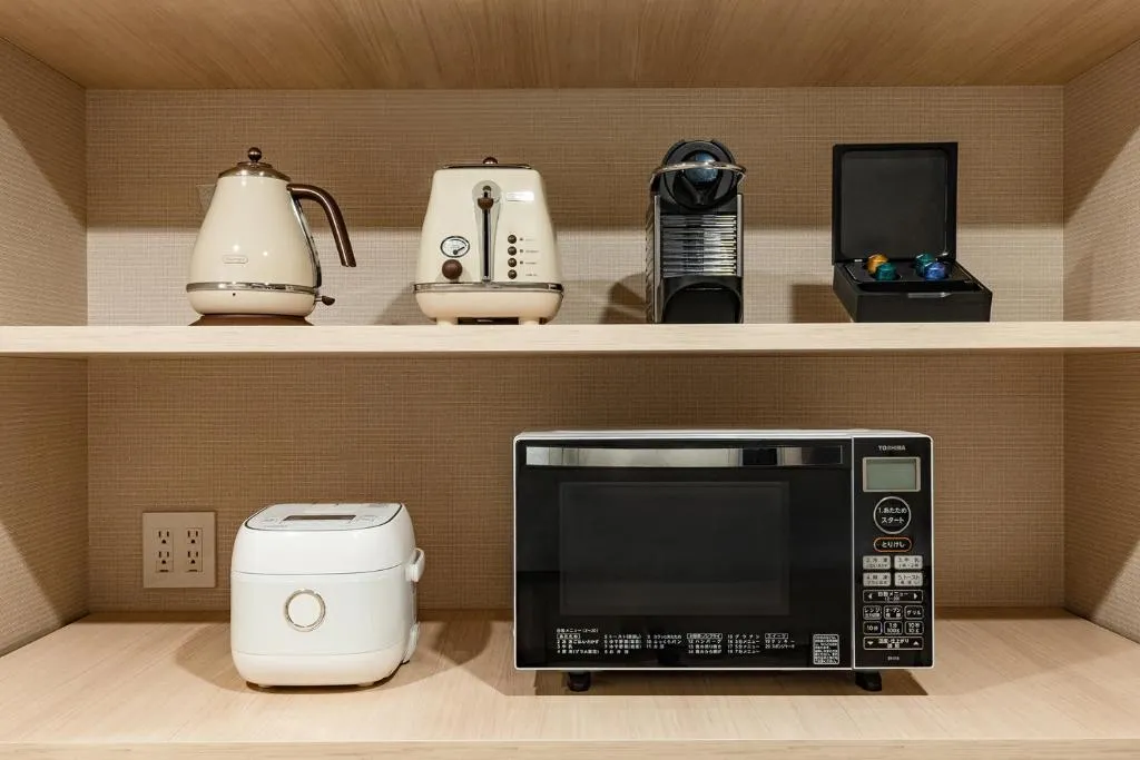 Kitchen appliances in OMO5 Yokohama Bashamichi by Hoshino Resorts