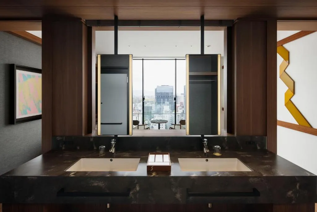 Bathroom with city view at One Fukuoka Hotel