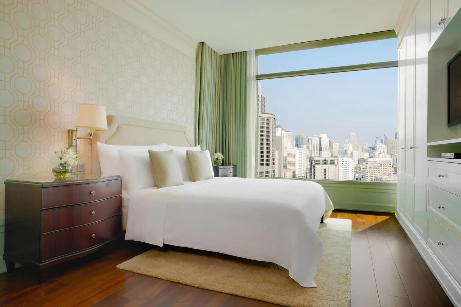Oriental Residence Bangkok bedroom with city skyline view