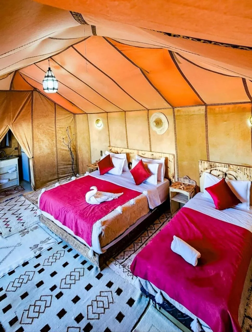 Spacious family tent room at Original Luxury Camp in Merzouga with multiple beds
